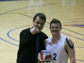 Brantford native Nick Rawls, volleyball coach at St. Andrews University, poses with player Jackson Stark who was recognized for his 3,000th career assist.