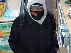 Police released a photo of a suspect wanted in two pharmacy robberies on Wednesday afternoon.