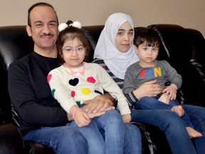Rideau Bridge to Canada's newly arrived Syrian refugee family in Merrickville had to contend with numerous delays brought on by the pandemic before finally arriving Oct. 6 2020. From left, Odae with his daughter Sham on his lap, and Haifaa with 19-month-old Zain. (HEDDY SOROUR/Local Journalism Initiative Reporter)