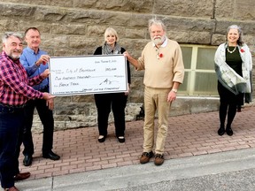 From left, Graeme Sifton and Jay Martin of the Carolyn Sifton Foundation, Brockville Coun. Jane Fullarton, Brock Trail COmmitteechamriam John Taylor and city manager Janette Loveys gather beside city hall to mark a $100,000 donation for the continuation of the work that will connect the Brockville Railway Tunnel to the Brock Trail. (SUBMITTED PHOTO)