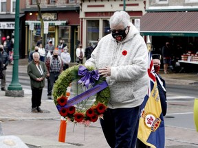 Silver Cross Women Of Canada representative Ruby Wylie prepares to lay a wreath at Brockville's cenotaph during a COVID-reduced Remembrance Day ceremony on Wednesday. (RONALD ZAJAC/The Recorder and Times)