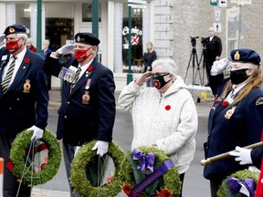 From left, Bob Golden, the Royal Canadian Legion Branch 96 Poppy Campaign chairman, branch president Ralph McMullen, Silver Cross Mother Ruby Wylie and Mary Ann Greenwood, president of the Ladies Auxiliary, salute during the Last Post at Brockville's COVID-reduced Remembrance Day ceremony last November. (RONALD ZAJAC/The Recorder and Times)