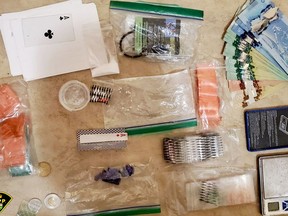 Provincial police released this photo of items seized in a drug bust in Smiths Falls on Friday. (SUBMITTED PHOTO)