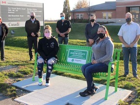 A memorial bench has been installed along the Greenfield Global Trail on Bloomfield Road in Chatham to honour the memory of Austin Scott, who died at age 18 after being struck by a vehicle while riding his bicycle on the evening of Nov. 25, 2015. Pictured in front are his sister Alissa Scott, 21, left, and mother Jenn Scott during a ceremony on Sunday. Pictured from back left are: Angelo Ligori, senior advisor with Greenfield Global, Neil Bishop, Greenfield Global vice-president of operations, Greg Devries and Hilco Tamminga, partners in Truly Green Farms greenhouses, and Jeff Bray, manager of parks and open spaces with the Municipality of Chatham-Kent.