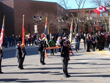 Although the Remembrance Day service in downtown Chatham on Wednesday was billed as being invite-only due to COVID-19 precautions, several people still came out to show their respect to those who made the supreme sacrifice. Ellwood Shreve/Chatham Daily News/Postmedia