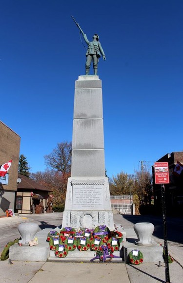 Wreaths and poppies adorn the base of the cenotaph in downtown Chatham following a Remembrance Day service on Wednesday. Ellwood Shreve/Chatham Daily News/Postmedia