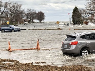 Powerful winds pushed waves from Lake St. Clair well past the pier at Mitchell's Bay, causing extensive flooding in the lakeside community in northwest Chatham-Kent on Sunday. Ellwood Shreve/Chatham Daily News/Postmedia Network