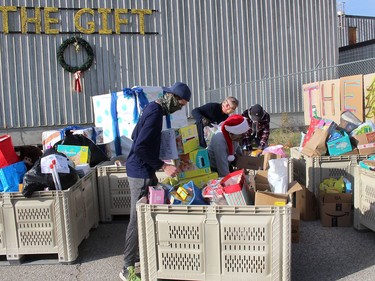 Volunteers were busy sorting through donations of food and toys that local residents gave to The Gift CK, which was held across Chatham-Kent on Saturday. Ellwood Shreve/Chatham Daily News/Postmedia Network