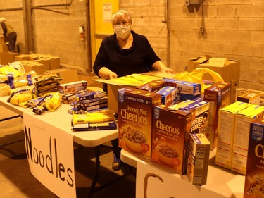 Rhonda Quenneville sorts donations of pasta that was donated by residents to the The Gift CK, which was held across Chatham-Kent on Saturday. Ellwood Shreve/Chatham Daily News/Postmedia Network