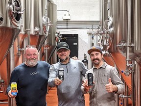 Sons of Kent Brewing Company won gold, silver and bronze at the recent Ontario Brewing Awards. Brewery partners Tim Copeland, left, holds the Juice Box, which won silver, Doug Hunter, centre holds the Don't Panic hazy IPA that took silver, and Colin Chrysler holds the Scotch Ale that won the Chatham-based craft brewery a gold medal.