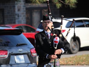 Piper and veteran Ken Stephens, at the 2020 Remembrance Day ceremony held at the Ingleside Cenotaph. Photo on Sunday, November 8, 2020, in Ingleside, Ont. Todd Hambleton/Cornwall Standard-Freeholder/Postmedia Network