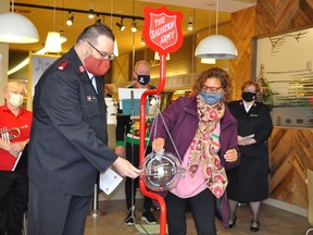 Cornwall Mayor Bernadette Clement provided the first donation to this year's Salvation Army Kettle Campaign on Saturday at the Cornwall Farm Boy. She is pictured with Major Derran Wiseman. Francis Racine/Cornwall Standard-Freeholder/Postmedia Network