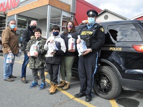 The SDG OPP Stuff the Cruiser event took place throughout SDG on Saturday November 14, 2020. Pictured are Agape Centre volunteers Dan Belanger and Chris Quenville, helpers Theodore and Steven Kofinas and Auxiliary Sergeants  Lambia Karitsiotis and Doug Behn, who collected donations at the Foodland in Ingleside. Francis Racine/Cornwall Standard-Freeholder/Postmedia Network