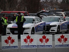 Part of the Cornwall Police Service presence, on the other side of Pitt St. and near the Cornwall March for Freedom. Photo on Saturday, November 21, 2020, in Cornwall, Ont. Todd Hambleton/Cornwall Standard-Freeholder/Postmedia Network