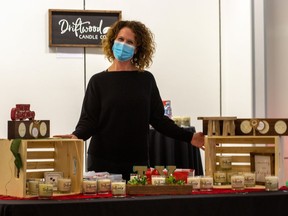 Reneé Gadbois, owner of Driftwood Candle Co. at her table at the holiday market, part of a marketplace set up at the Cornwall Square on the first floor of the shopping centre.. Photo taken on Saturday November 21, 2020 in Cornwall, Ont. 
John Macgillis/Special to the Cornwall Standard-Freeholder/Postmedia Network