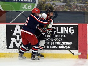 Cornwall Colts Emerick Nadeau keeps a Brockville Braves player against the boards during scrimmage play on Saturday November 21, 2020 in Cornwall, Ont. Robert Lefebvre/Special to the Cornwall Standard-Freeholder/Postmedia Network