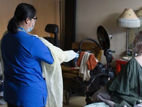 A Personal Support Worker helps out in a Toronto assisted living home. COVID lockdowns and other precautions have forced many women to choose between their kids' welfare and keeping a job.