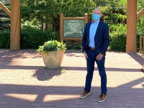 Mayor Jeff Genung stands outside the RancheHouse wearing his mask on July 29 after he and other councillors passed a face covering requirement should active cases reach 10, a figure that's been reached three months later.