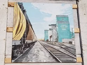 Donna Brinks picture of grain elevators has been added to the artwork on the exterior of the Hanna Roundhouse. Hanna Roundhouse Society photo