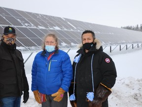 L-R: Chief Allan Adam of Athabasca Chipewyan First Nation, Blue-Eyes Simpson of Fort Chipewyan Métis Association and Chief Peter Powder of Mikisew Cree First Nation stand outside the 3NE solar farm project in Fort Chipewyan on November 17, 2020. Supplied Image/3NE