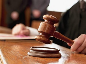 Close up of judge raising gavel in courtroom