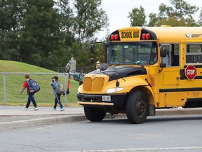 A school bus drops students off at Walden Public School in Lively, Ont. on Tuesday, Sept. 8, 2020. John Lappa/Sudbury Star/Postmedia Network