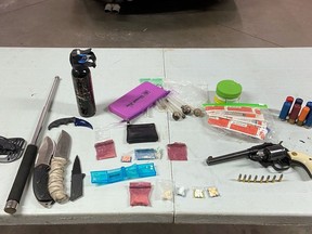 Drugs and weapons seized by Ontario Provincial Police during a RIDE program on Wolfe Island on Friday. (Supplied Photo)