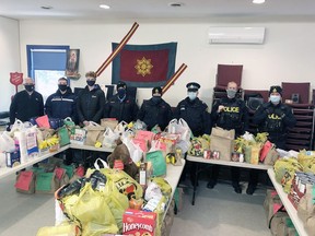 This year's KL OPP Fill a Cruiser Food Drive was another huge success. In the photo are Salvation Army Chaplain Robbie Donaldson, Kirkland Lake Gold Miners' Connor Van Wheelie and Glen Crandall along with OPP Auxilary Justin Creama, Cst. Adam Gauthier, Sgt. Mike Robichaud, Cst. Corey Cranston and Cst. Dalton Crockett.