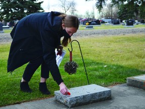 City officials, community members and local students gathered at the Leduc Municipal Cemetery for the No Stone Left Alone Remembrance Event on Nov. 1. (Lisa Berg)