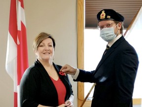 Mayor Janet Jabush received a poppy from Jonathan Arseneault, the popy committee chair for Legion Branch #126.