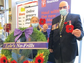 Photo by CINDY WOODS/FOR THE STANDARD
Volunteer Sue Jarmovich and Royal Canadian Legion Branch 561 Poppy Chair Al Warman were set up at No Frills on Saturday, Oct. 31 to sell poppies.