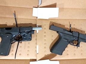 A loaded Colt 45-calibre handgun and a loaded Glock 9mm handgun, as well as suspected drugs, and cash were seized in the 1000 block area of Clarence Street in North Bay Tuesday. 
Supplied Photo