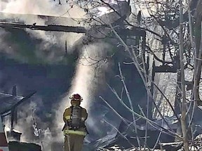 A firefighter examines the smouldering remains of a Yonge Street barn in Burk's Falls after an Oct. 30 fire. A GoFundMe campaign has raised $10,500 as of Monday morning to help the tenant replace thousands of dollars worth of woodworking tools, equipment and supplies.
Lisa Tommy Photo