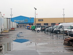 Trailers are parked in a fenced-off area of the parking lot in front of Walmart in North Bay, Thursday. The cleanup effort continues while police and the Ontario Fire Marshal's Office continue their investigations into a Friday fire.
PJ Wilson/The Nugget