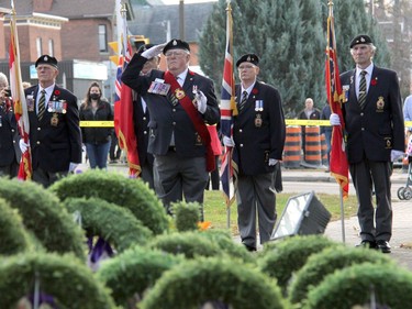 With the majority of wreaths already pre-placed at the Pembroke cenotaph, Pembroke Legion Branch 72 Sergeant-at-Arms Chris Thorbourne salutes at the head of the colour party as Remembrance Day ceremonies began. Anthony Dixon