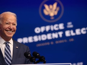 U.S. president-elect Joe Biden smiles as he speaks about health care and the Affordable Care Act (Obamacare) at the theatre serving as his transition headquarters in Wilmington, Del., on Tuesday. (Jonathan Ernst/Reuters)