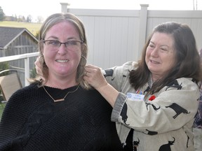 Once the shock and surprise wore off, Shannon O'Rourke (left) was thrilled to be recognized as the Rotary Club of Mitchell's 2019 Citizen of the Year Nov. 7. Above, President Carol McClure placed a necklace around her neck for recognition of her tireless volunteer efforts throughout the community. ANDY BADER/MITCHELL ADVOCATE