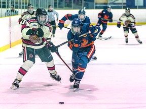 Mason Chitaroni (left) of the Blind River Beavers defends against Soo Thunderbirds forward Avery Rebek in recent Northern Ontario Jr. Hockey League regular season action at John Rhodes Community Center. BOB DAVIES