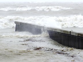 Water washes over a steel groyne in Bright's Grove Oct. 30, 2012. (Observer file  photo)