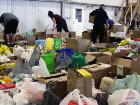 Volunteers sort donations during a Lambton County-wide food drive on Saturday November 7, 2020 in Petrolia, Ont. (Terry Bridge/Sarnia Observer)