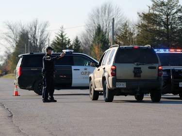 Lambton OPP tell a motorist to turn around at a barricade at Indian and Greenbird lanes on Sunday November 8, 2020 in Kettle Point First Nation, Ont. Terry Bridge/Sarnia Observer/Postmedia Network