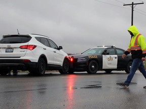 An OPP cruiser and a white Hyundai Santa Fe collided near the intersection of Camlachie Road and Churchill Line on Thursday November 26, 2020 in Enniskillen Township, Ont. (Terry Bridge/Sarnia Observer)