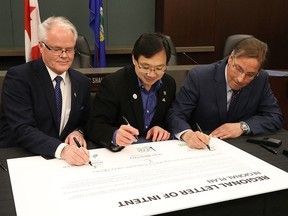 City of Spruce Grove Mayor Stuart Houston, Stony Plain Mayor William Choy and Parkland County Mayor Rod Shaigec sign a Regional Letter of Intent to work on a regional plan at the Parkland County office on Tuesday, Jan. 15, 2019.