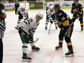 The Spruce Grove Saints defeared the Sherwood Park Crusaders 4-3 in overtime on Friday to kick off the 2020-21 AJHL season. Here Saints centre Jacob Rochford and Crusaders centre Ty Mueller eye the puck in the referees hand prior to puck drop.  Josh Thomas.