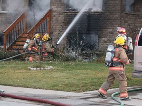 PORT DOVER FIRE Norfolk County firefighters worked to extinguish a house fire on 1st Ave. near McNab St. W. in Port Dover on Tuesday afternoon. Police on scene say the fire does not look suspicious. (ASHLEY TAYLOR)