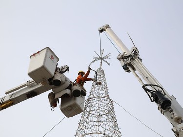 Jeremie Ducharme, of Greater Sudbury Hydro, sets up a tree for the Sudbury Charities Foundation's annual Festival of Lights on the grounds of Science North in Sudbury, Ont. on Friday November 6, 2020. The Festival of Lights virtual launch party will be held on Nov. 22 at 6:30 p.m. John Lappa/Sudbury Star/Postmedia Network