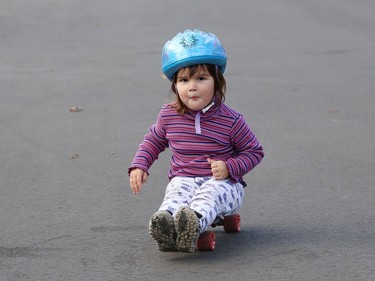 Adeline Gareau, 2, has her own technique and style for skateboarding in her neighbourhood in Sudbury, Ont. on Tuesday November 10, 2020. John Lappa/Sudbury Star/Postmedia Network