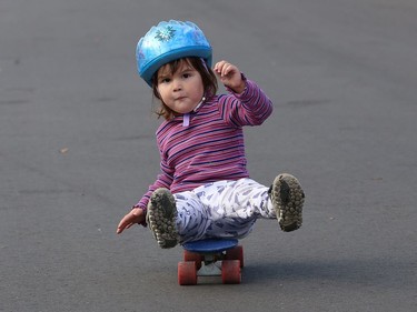 Adeline Gareau, 2, has her own technique and style for skateboarding in her neighbourhood in Sudbury, Ont. on Tuesday November 10, 2020. John Lappa/Sudbury Star/Postmedia Network