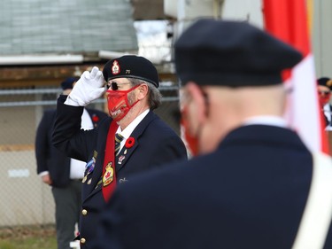 Sergeant-at-arms Charlie Skelly salutes during a Remembrance Day service at Branch 76 of the Royal Canadian Legion in Sudbury, Ont. on Wednesday November 11, 2020. John Lappa/Sudbury Star/Postmedia Network