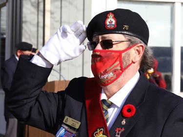 Sergeant-at-arms Charlie Skelly salutes during a Remembrance Day service at Branch 76 of the Royal Canadian Legion in Sudbury, Ont. on Wednesday November 11, 2020. John Lappa/Sudbury Star/Postmedia Network